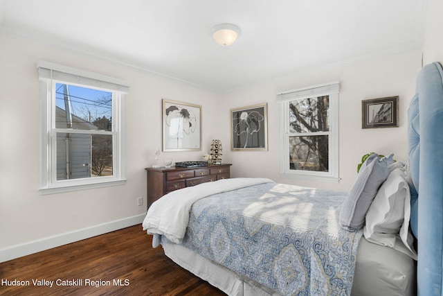 bedroom with dark wood-type flooring