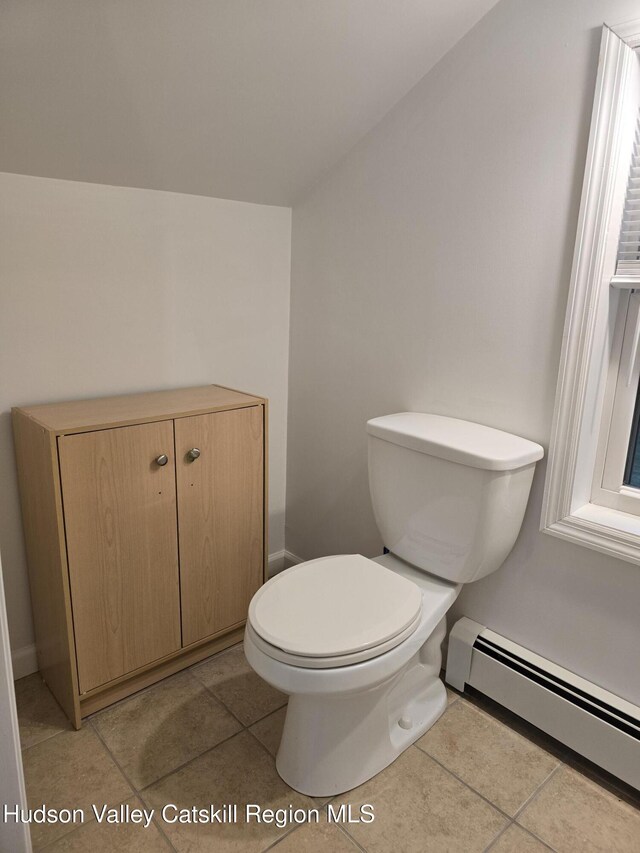 280 Continental Rd, Napanoch, NY 12489 - bathroom featuring a baseboard radiator, toilet, tile patterned flooring, and baseboards