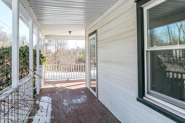 wooden terrace with a porch