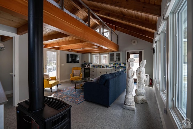  - living room with wooden ceiling, wine cooler, baseboards, and a wood stove
