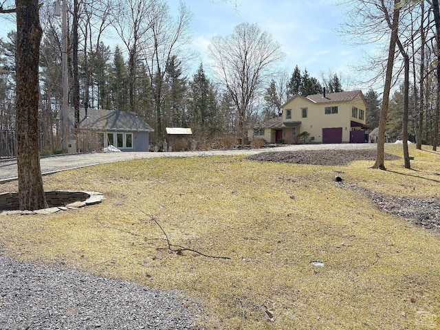  - view of yard with a garage