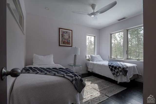  - bedroom with wood-type flooring, ceiling fan, and baseboards
