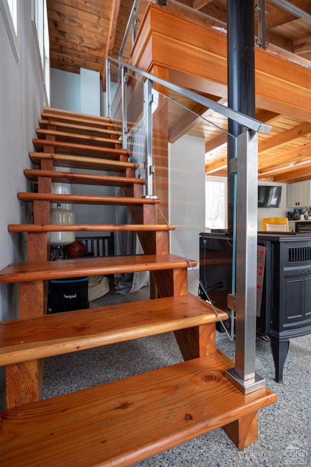  - stairs featuring a wood stove