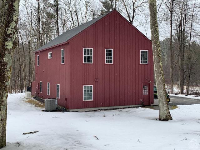  - view of snowy exterior featuring cooling unit