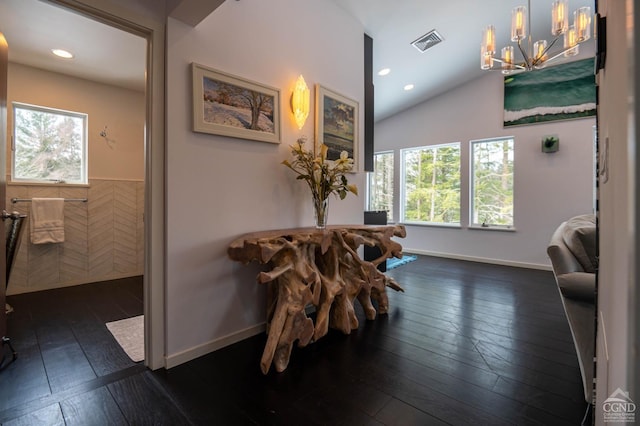  - hall with healthy amount of natural light, a chandelier, dark wood finished floors, recessed lighting, and lofted ceiling