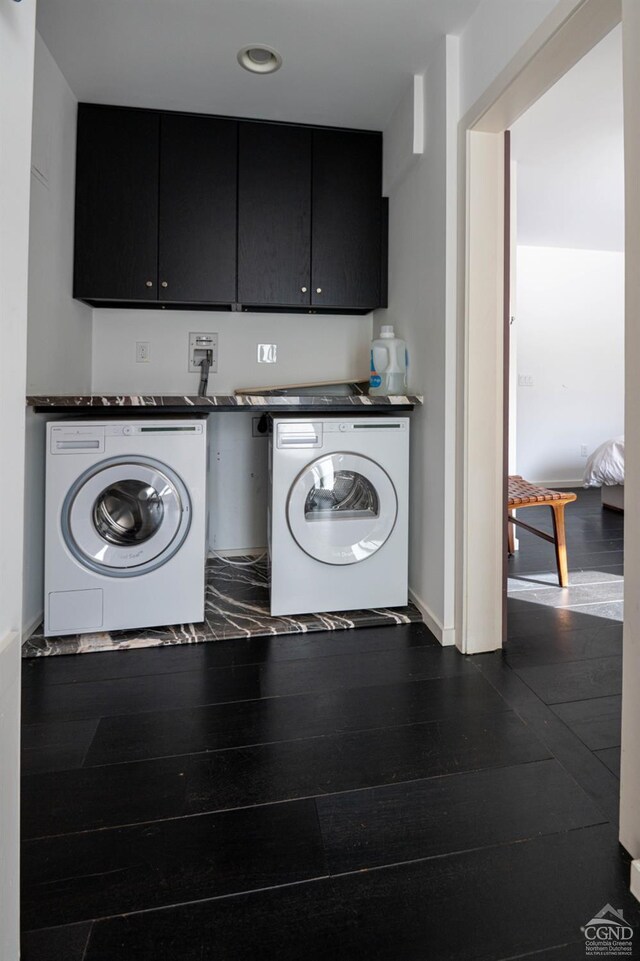 - laundry room with separate washer and dryer, dark wood-style floors, cabinet space, and recessed lighting
