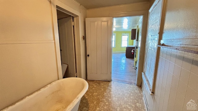 801 Columbia St, Hudson, NY 12534 - bathroom featuring a freestanding tub and tile patterned flooring