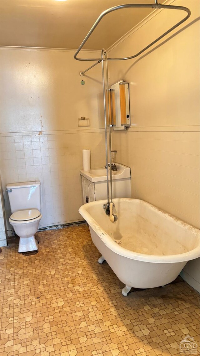 801 Columbia St, Hudson, NY 12534 - bathroom featuring toilet, tile patterned floors, a freestanding bath, a shower, and tile walls