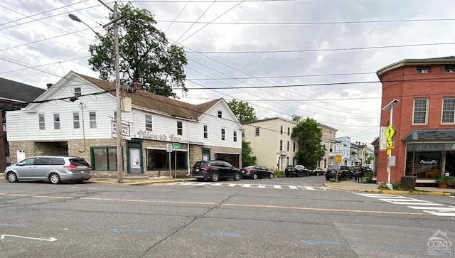 801 Columbia St, Hudson, NY 12534 - view of asphalt road with curbs, sidewalks, a residential view, and street lights