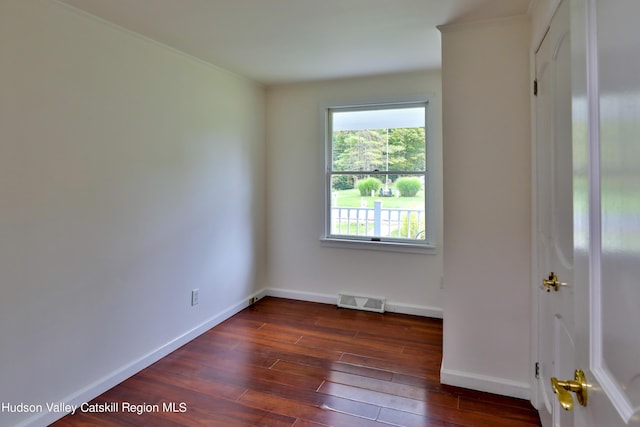 empty room featuring dark hardwood / wood-style floors