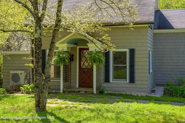 11351 State Rte 22, Austerlitz, NY 12017 - doorway to property featuring a shingled roof, a yard, and ac unit