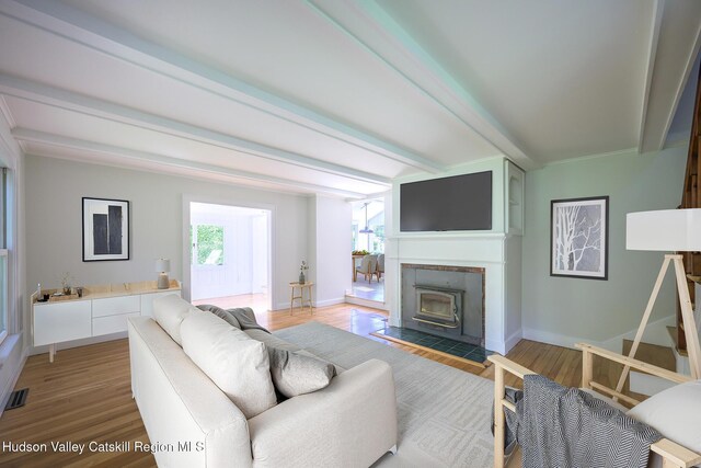 11351 State Rte 22, Austerlitz, NY 12017 - living room featuring beamed ceiling, light wood finished floors, and baseboards
