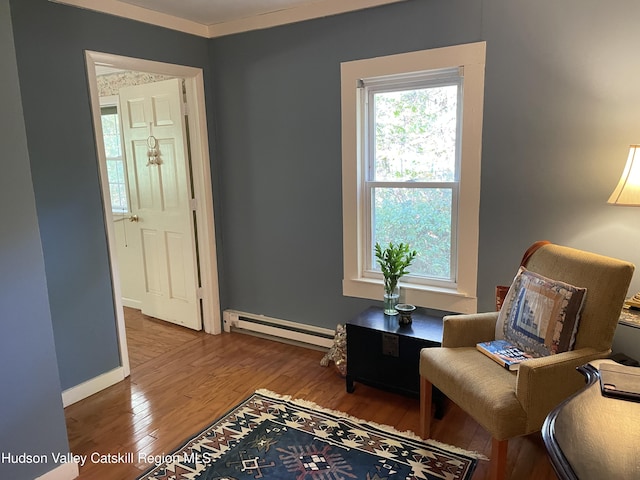 89 Bloomingdale Rd, Tillson, NY 12486 - sitting room with a baseboard radiator, wood finished floors, and baseboards