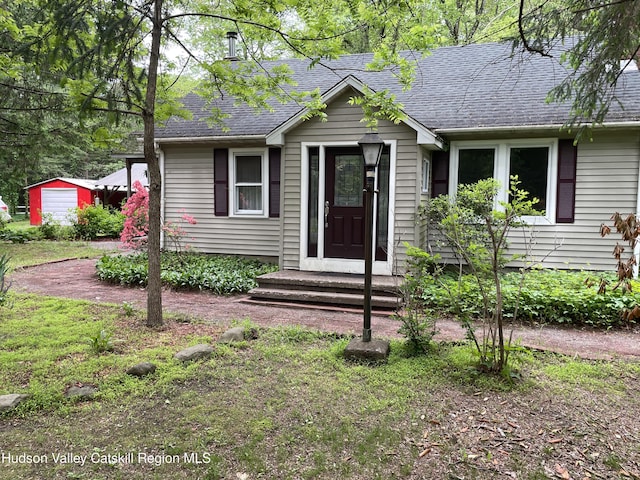 89 Bloomingdale Rd, Tillson, NY 12486 - view of front of property with a shingled roof and an outdoor structure