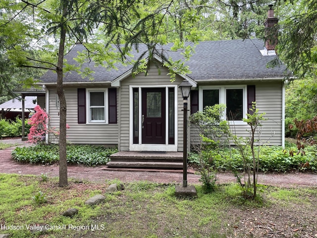 89 Bloomingdale Rd, Tillson, NY 12486 - view of front of home with a chimney and a shingled roof