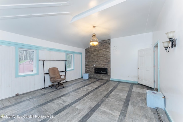 296 Circle Rd, Cragsmoor, NY 12420 - unfurnished living room featuring vaulted ceiling with beams, baseboards, and a stone fireplace