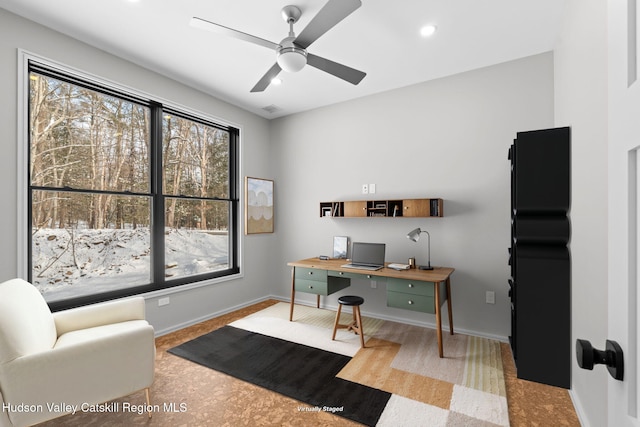 office with ceiling fan and a wealth of natural light