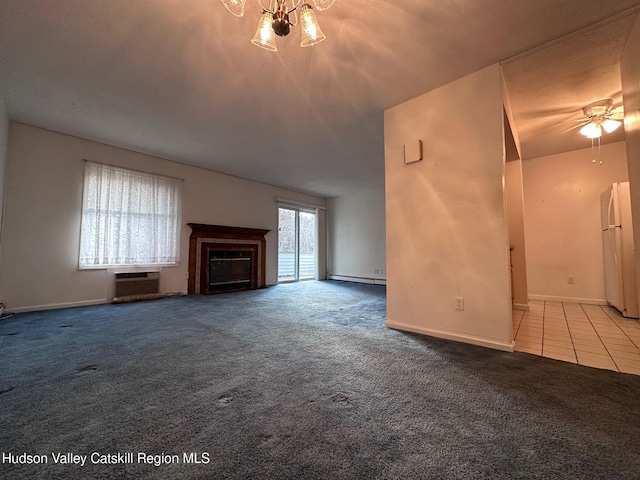 unfurnished living room featuring ceiling fan with notable chandelier, an AC wall unit, and light colored carpet