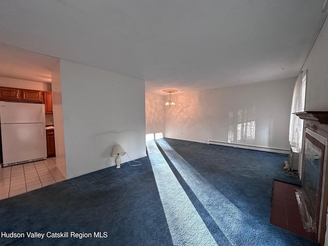 unfurnished living room featuring light carpet and baseboard heating