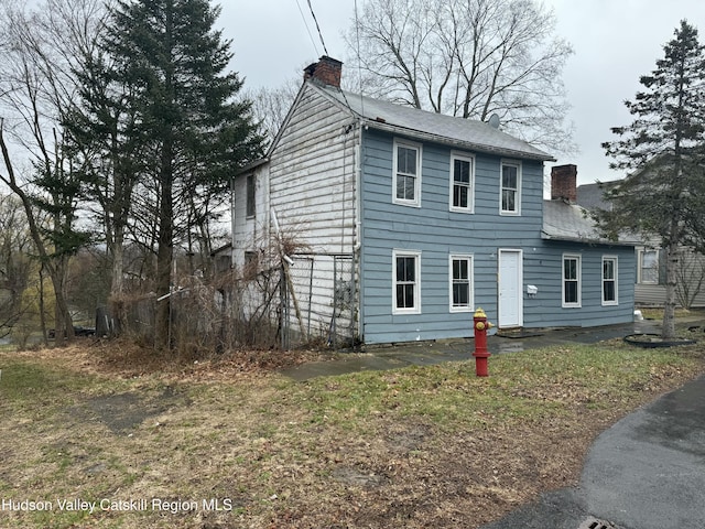 11 N Montgomery St, Athens, NY 12015 - view of side of property with a chimney