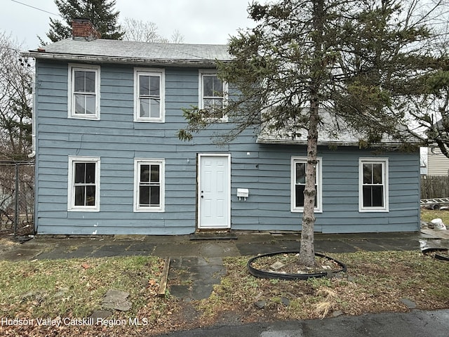 11 N Montgomery St, Athens, NY 12015 - colonial-style house featuring a patio, a chimney, fence, and roof with shingles