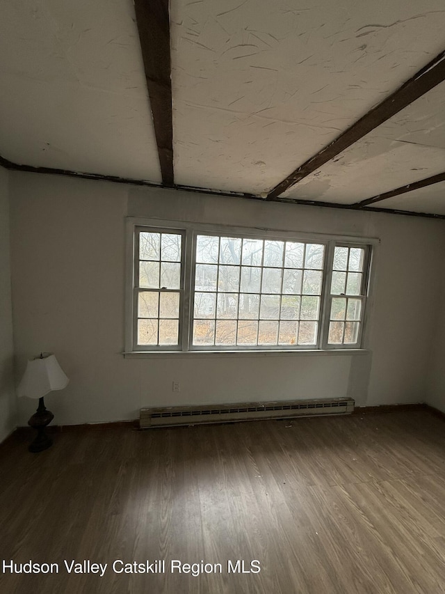 11 N Montgomery St, Athens, NY 12015 - spare room with wood finished floors, a baseboard heating unit, and beamed ceiling