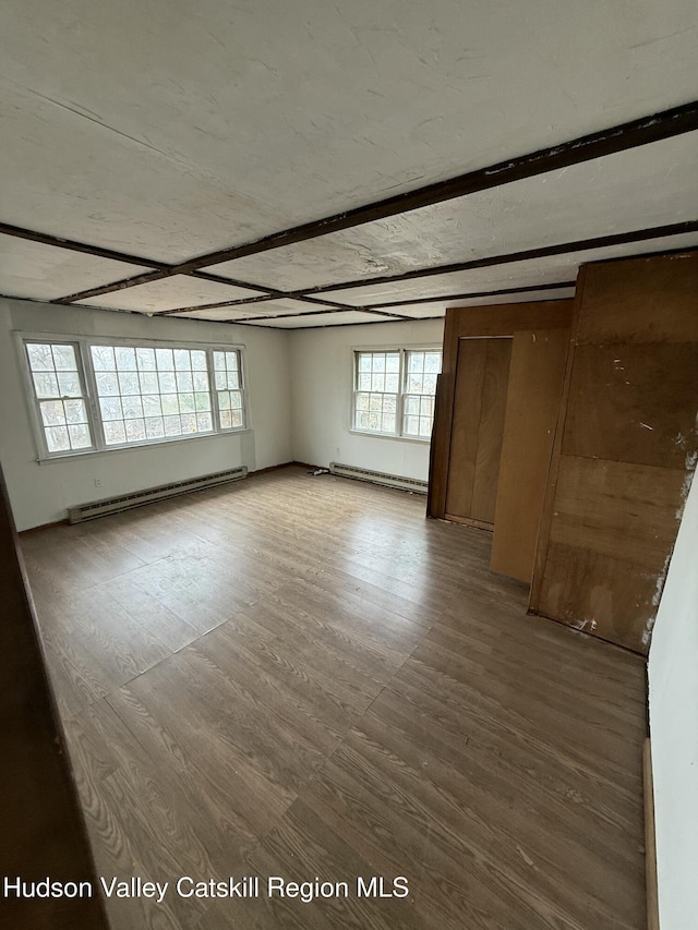 11 N Montgomery St, Athens, NY 12015 - empty room featuring beam ceiling, wood finished floors, and baseboard heating