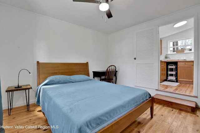 bedroom featuring a ceiling fan and light wood-style flooring