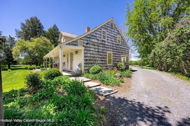 view of property exterior featuring a yard