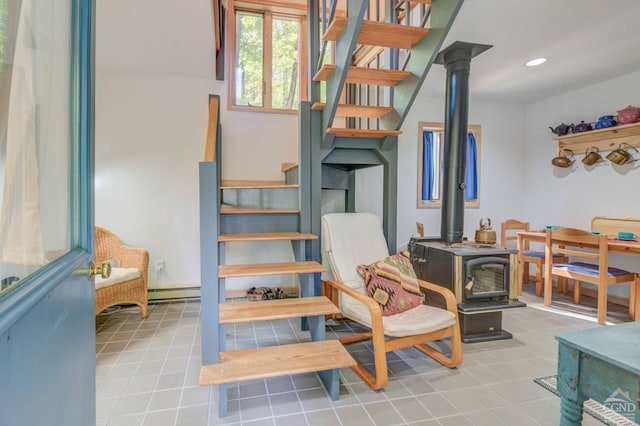 192 Old Queechy Rd, Canaan, NY 12029 - stairs featuring a wood stove, baseboard heating, tile patterned floors, and recessed lighting