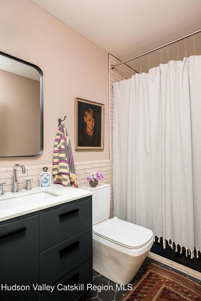 72 Old Queechy Rd, Canaan, NY 12029 - full bathroom with vanity, tile walls, and a shower with shower curtain