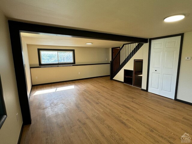 369 Newry Ln, Greenville, NY 12083 - below grade area with stairway, wood finished floors, and baseboards