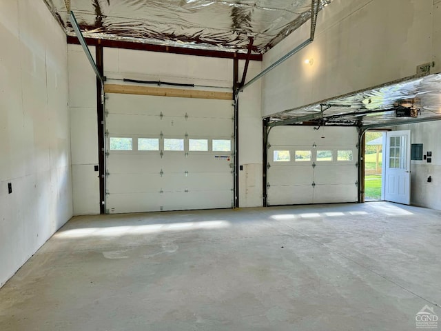 369 Newry Ln, Greenville, NY 12083 - garage with electric panel and a garage door opener