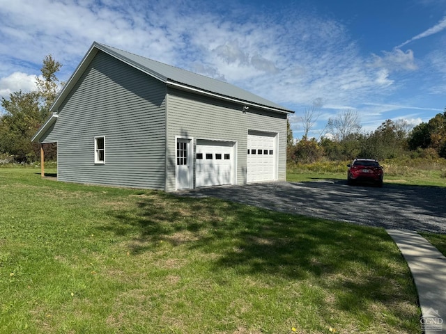 369 Newry Ln, Greenville, NY 12083 - view of property exterior with an outdoor structure, a yard, a garage, and metal roof