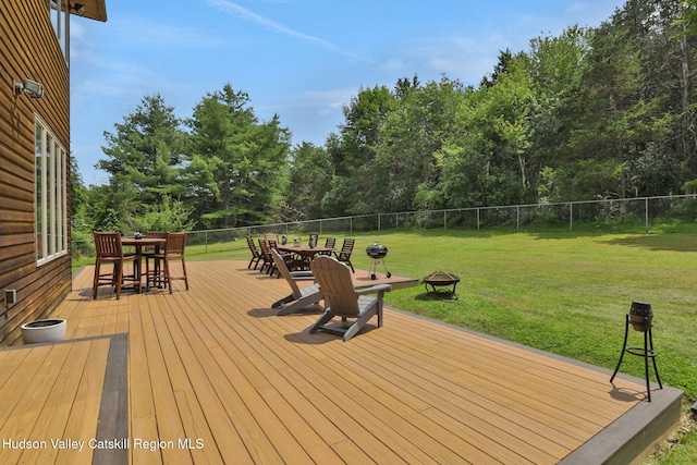 374 Linderman Ave, Kingston, NY 12401 - deck with outdoor dining space, an outdoor fire pit, and view of wooded area