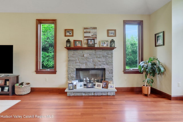 374 Linderman Ave, Kingston, NY 12401 - living area with wood finished floors and a stone fireplace