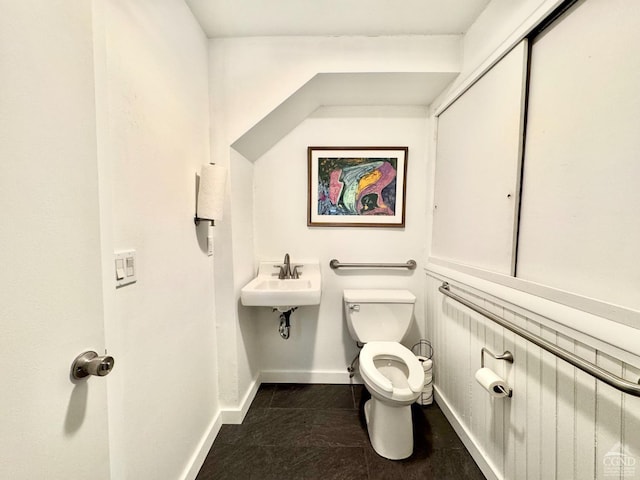 398 Main St, Catskill, NY 12414 - bathroom with toilet, baseboards, and a sink