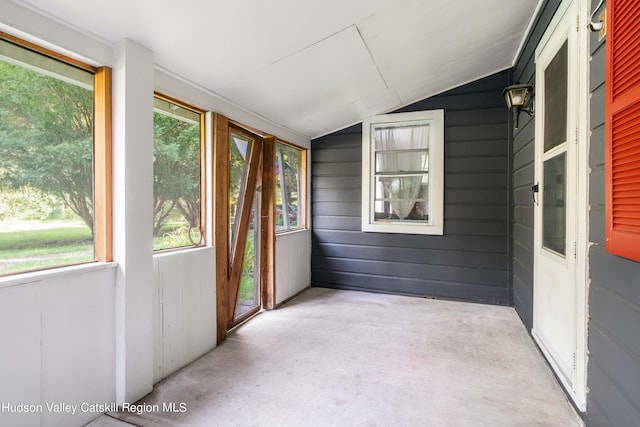 unfurnished sunroom with vaulted ceiling