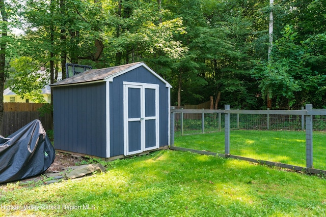 view of shed with a fenced backyard