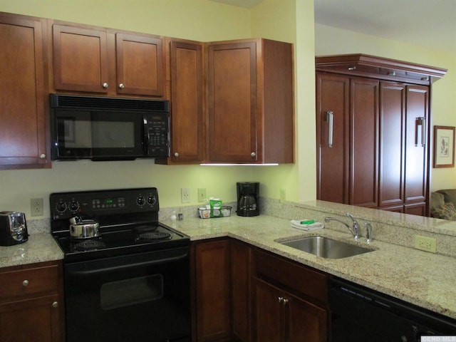62 Liftside Dr Unit 306F1, Hunter, NY 12442 - kitchen with black appliances, a sink, and light stone countertops