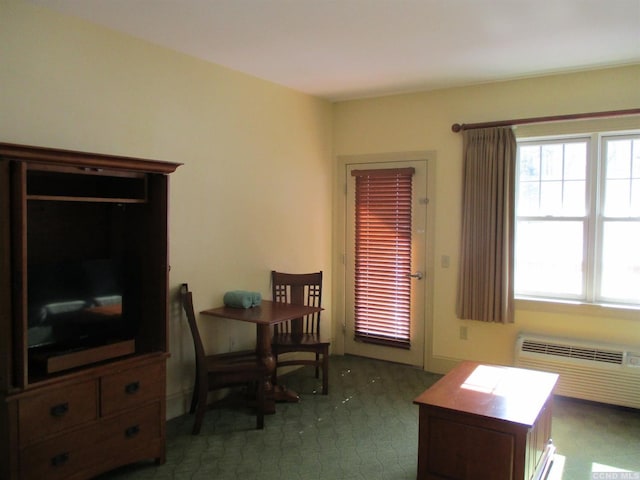 62 Liftside Dr Unit 306F1, Hunter, NY 12442 - living area with healthy amount of natural light and a wall mounted AC