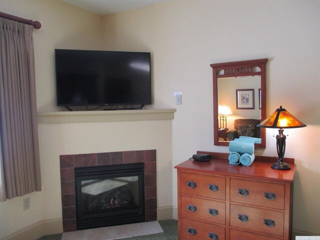 62 Liftside Dr Unit 306F1, Hunter, NY 12442 - living room with a tiled fireplace