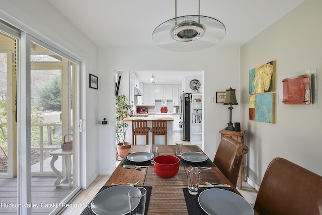 33 Cottonwood Ln, Woodstock, NY 12498 - dining area with healthy amount of natural light and light tile patterned floors