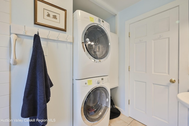 33 Cottonwood Ln, Woodstock, NY 12498 - laundry area featuring stacked washer and clothes dryer and light tile patterned floors