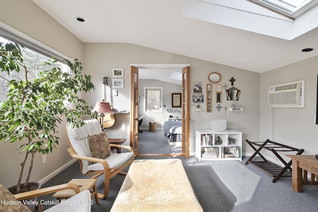 33 Cottonwood Ln, Woodstock, NY 12498 - sitting room featuring carpet floors, a skylight, an AC wall unit, healthy amount of natural light, and lofted ceiling