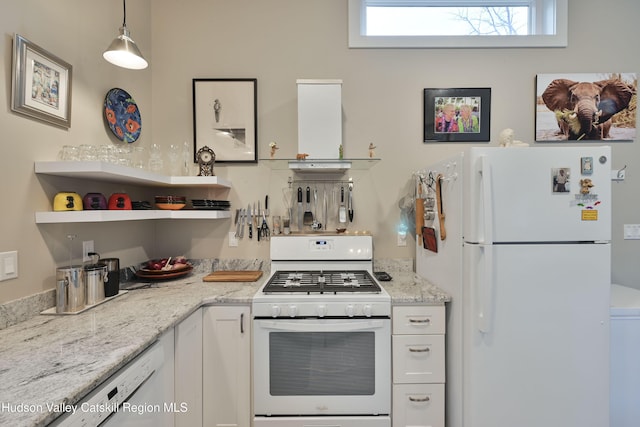 33 Cottonwood Ln, Woodstock, NY 12498 - kitchen with white appliances, white cabinets, healthy amount of natural light, and light stone counters