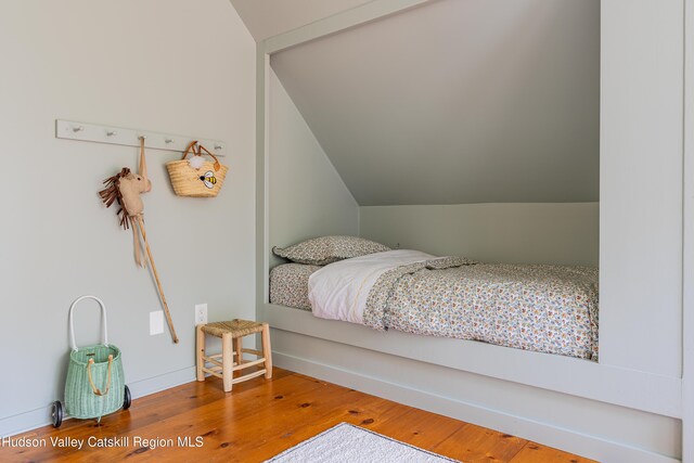 36 Ridgewood Rd, Kerhonkson, NY 12446 - bedroom featuring wood finished floors and lofted ceiling
