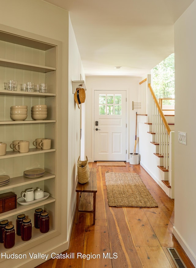 36 Ridgewood Rd, Kerhonkson, NY 12446 - foyer entrance with wood-type flooring, stairway, and baseboards