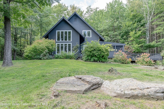 36 Ridgewood Rd, Kerhonkson, NY 12446 - back of property with a lawn and a wooden deck