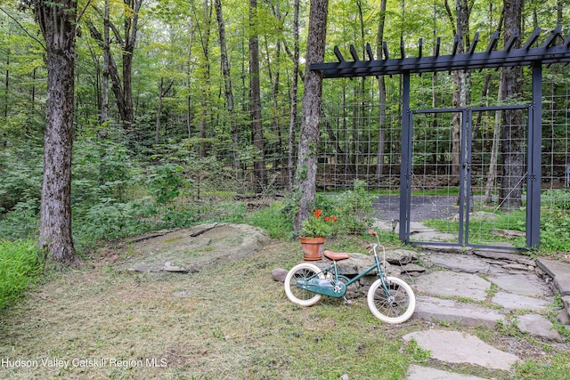 36 Ridgewood Rd, Kerhonkson, NY 12446 - view of yard featuring a gate and a wooded view